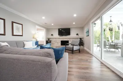 a living room with a couch and a fireplace at Destination #39 in Orange