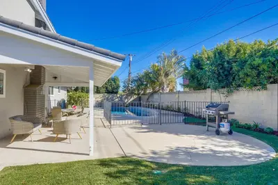 a patio with chairs and a grill in a yard at Destination #44 in Orange