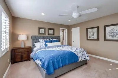 a bedroom with a bed and a ceiling fan at Destination #48 in Placentia