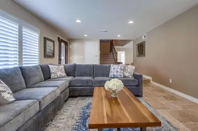 a living room with a couch and a coffee table at Destination #48 in Placentia