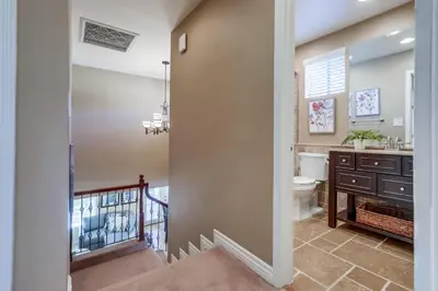 a bathroom with a toilet and a sink at Destination #48 in Placentia