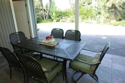 a black table and chairs with a tray of food on it at Destination #14 in Anaheim