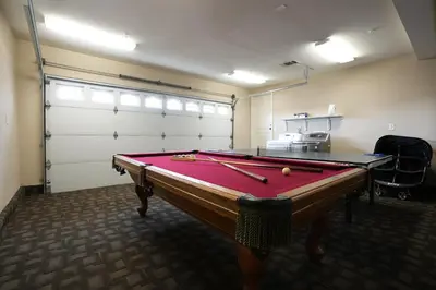 a pool table in a room with a garage at Destination #14 in Anaheim