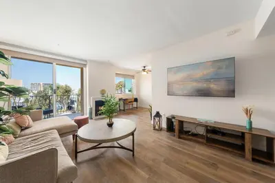 a living room with a couch and a table at The Blossom-Modern 1BR Getaway in Marina Walk to Water&Restaurants in Los Angeles
