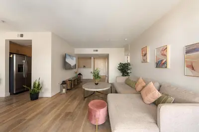 a living room with a couch and a table at The Blossom-Modern 1BR Getaway in Marina Walk to Water&Restaurants in Los Angeles