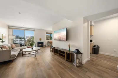 a living room with a couch and a table at The Blossom-Modern 1BR Getaway in Marina Walk to Water&Restaurants in Los Angeles