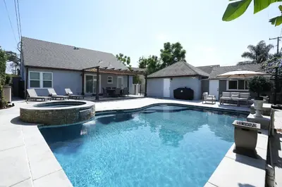 a swimming pool in front of a house at Destination #51 in Santa Ana