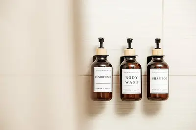 four bottles of wine sitting on a shelf at Beautiful Studio in West Hollywood in Los Angeles