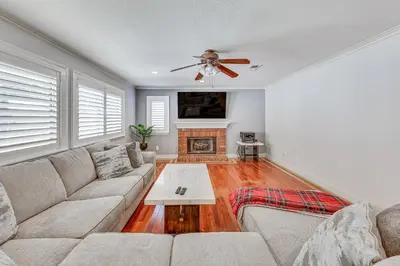 a living room with a couch and a fireplace at Large Rancho Cucamonga Home 5 Mi to Red Hill Park in Rancho Cucamonga
