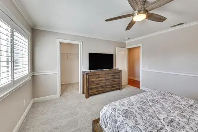 a bedroom with a bed and a flat screen tv at Large Rancho Cucamonga Home 5 Mi to Red Hill Park in Rancho Cucamonga