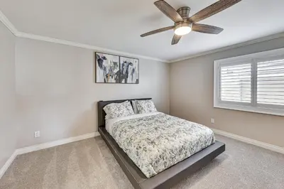 a bedroom with a bed and a ceiling fan at Large Rancho Cucamonga Home 5 Mi to Red Hill Park in Rancho Cucamonga