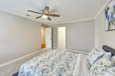 a bedroom with a bed and a ceiling fan at Large Rancho Cucamonga Home 5 Mi to Red Hill Park in Rancho Cucamonga