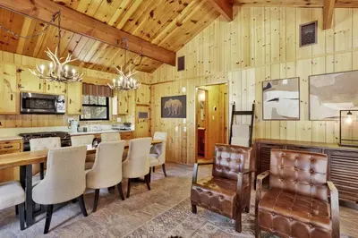 a kitchen and dining room with a table and chairs at Bruin Chalet Big Bear~ Cozy Single Level Retreat Cottage~ in Big Bear Lake