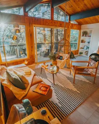 a living room with a couch and a chair at Lightfoot Cabin Mid-Century Perfect Romantic Getaway Hot Tub Sauna in Running Springs