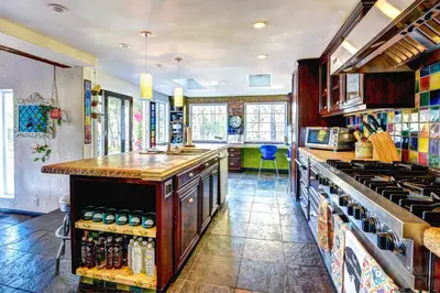 a kitchen with a counter and a stove top oven at The Malibu Retreat Private Compound w/ Salt Water Pool + Views in Malibu