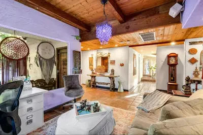 a living room with a couch and a table at The Malibu Retreat Private Compound w/ Salt Water Pool + Views in Malibu