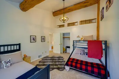 a bedroom with a bunk bed in a room at Pinon Pines Vacation Rental Hike, Bike and ATV! in Pine Mountain Club