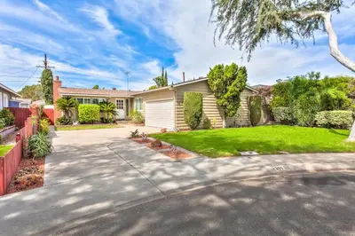 a house with a driveway and a yard at Walk To Disneyland, Watch Firework Front Yard, SPA in Anaheim