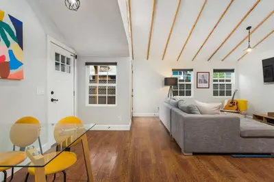 a living room with a couch and a glass table at Downtown Culver City House w/ Backyard, AC & Garage in Los Angeles