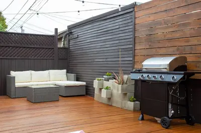 a patio with a grill and a couch and a barbecue at Downtown Culver City House w/ Backyard, AC & Garage in Los Angeles