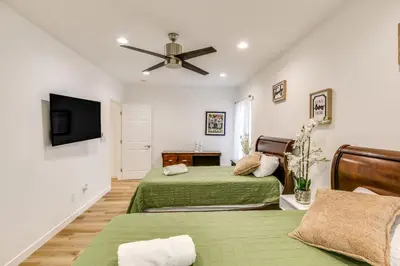 a bedroom with two beds and a ceiling fan at 7 Mi to Dtwn! Modern Retreat in East Los Angeles in East Los Angeles