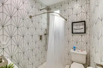 a bathroom with a shower and a toilet in it at 9 Mi to Dodger Stadium! East LA Studio with Patio in East Los Angeles