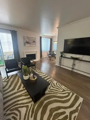 a living room with a large flat screen tv at Beverly Hills City Vibe 1 br Apt w Parking 324 in Los Angeles