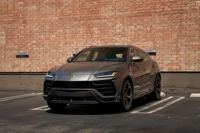 a car parked in a parking lot next to a brick wall at Beverly Hills City Vibe 1 br Apt w Parking 324 in Los Angeles