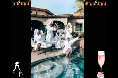 a group of people sitting around a swimming pool at Beverly Hills City Vibe 1 br Apt w Parking 324 in Los Angeles