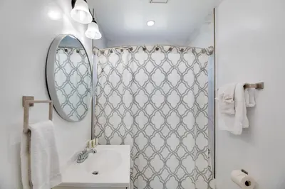 a bathroom with a sink and a mirror at 5 Mi to Venice Beach Chic Los Angeles Abode in Los Angeles