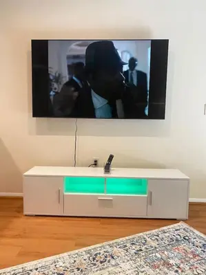 a bathroom with a sink and a tv on a wall at Adorable and Bright 2BD 2BR 740 in Los Angeles