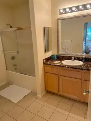 a bathroom with a sink and a shower and a mirror at Adorable and Bright 2BD 2BR 740 in Los Angeles
