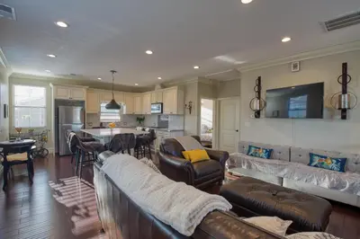 a living room with couches and a kitchen at Luxury 2 bed 1 bath in Torrance