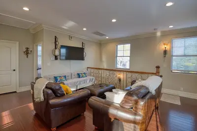 a living room with leather furniture and a flat screen tv at Luxury 2 bed 1 bath in Torrance