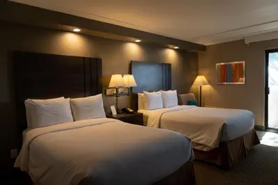 a hotel room with two beds and a window at GreenTree Inn & Suites Los Angeles - Alhambra - Pasadena in Alhambra