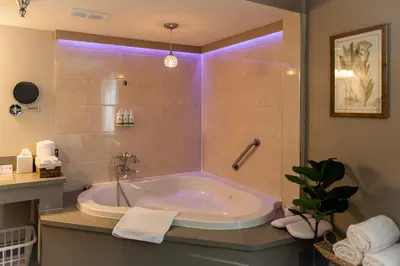 a bathroom with a bath tub with purple lighting at GreenTree Inn & Suites Los Angeles - Alhambra - Pasadena in Alhambra