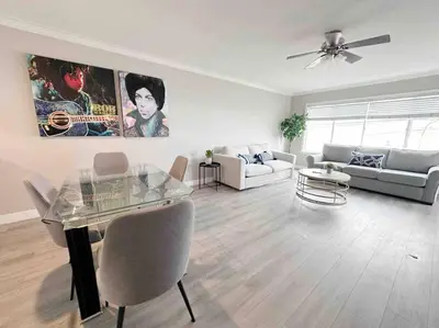 a living room with a glass table and a couch at Spacious South Bay Condo in Torrance