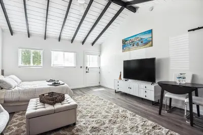 a living room with a couch and a flat screen tv at Private Studio Oasis with Nature at Your Doorstep in Thousand Oaks