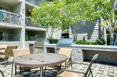 a patio with a table and chairs and a grill at Pasadena 1BR w gym pool nr Colorado Ave LAX-861 in Pasadena