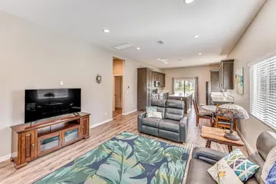 a living room with a couch and a tv at Peaceful Riverside Home with Patio, 7 Mi to Downtown in Riverside