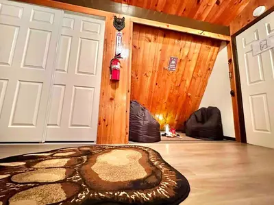 a room with a large rug next to a door at Cozy Cabin near Resorts and The Village +Mtn views in Big Bear City