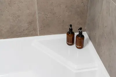 two bottles of soap sitting on a counter in a bathroom at Cozy Cabin near Resorts and The Village +Mtn views in Big Bear City