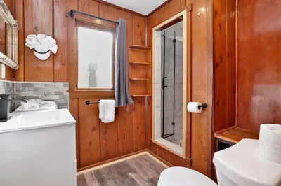 a bathroom with a toilet and a sink at Sunset Cottage Lakeside Couple's Cabin by Big Bear Vacations in Big Bear Lake