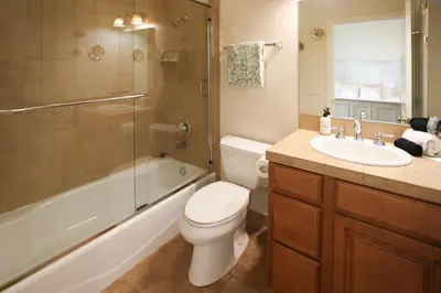 a bathroom with a toilet and a sink and a shower at 5 BR/5 BA Getaway with a View in Thousand Oaks