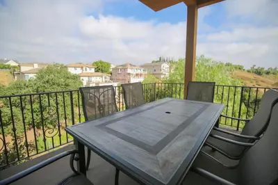 a table and chairs on a balcony with a view at 5 BR/5 BA Getaway with a View in Thousand Oaks
