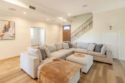 a large living room with a couch and a table at 5 BR/5 BA Getaway with a View in Thousand Oaks