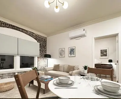 a living room with a table and a couch at New York Style 1bed 1bath West Hollywood in Los Angeles