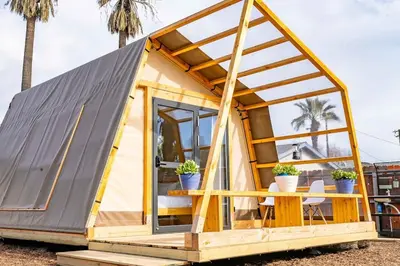 a tiny house with a pitched roof at Glamping in the Urban in Glendora