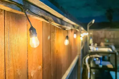 a row of lights hanging from a bathroom wall at Glamping in the Urban in Glendora