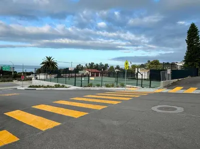 an empty street with a crosswalk on the road at SummerLillie #1 in Summerland